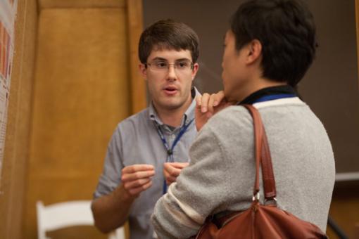  Explaining your ideas: Graduate Student Steven Criscione (left) fields questions at his poster.